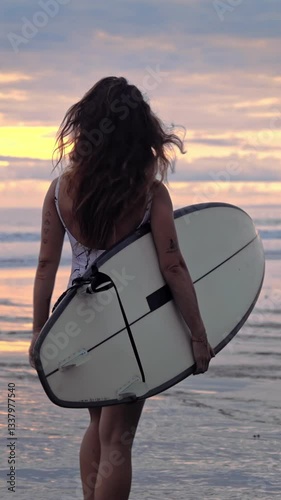 Woman Surfer With Surf Board At Sea Nature And Ocean Water Waves On Background. Person At Coast Beach Going With Surfboard. Caucasian Girl At Seaside Bay Moves To Swimming or Surfing For Relaxation