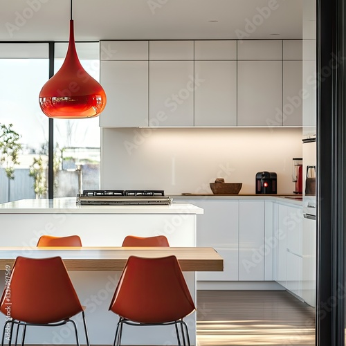 A contemporary kitchen with white cabinetry and a red pendant light.