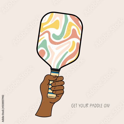 Human hand holding a vibrant pickleball paddle with the phrase Get your paddle on, representing enthusiasm, sports, and an active lifestyle
