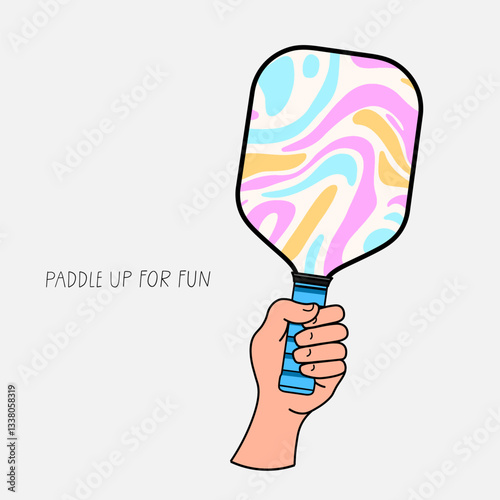 Human hand holding a colorful pickleball paddle with the phrase Paddle up for fun, symbolizing excitement, sports, and active lifestyle
