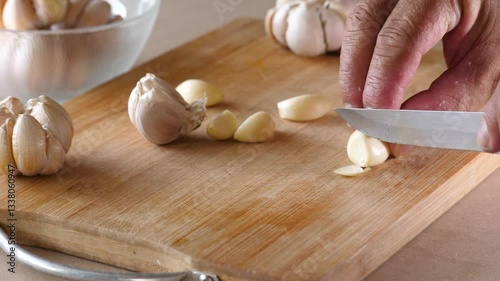 Slow motion of cutting fresh garlic