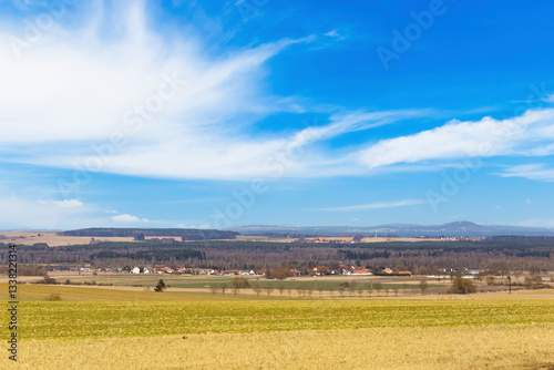 Forests, fields, and villages on the horizon in early spring. Central Europe
