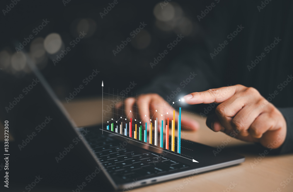 Fototapeta premium Business people analyze a company's financial data and balance sheet by working with digital virtual chart graphics. Businessmen use laptops to calculate financial data for long-term investments.