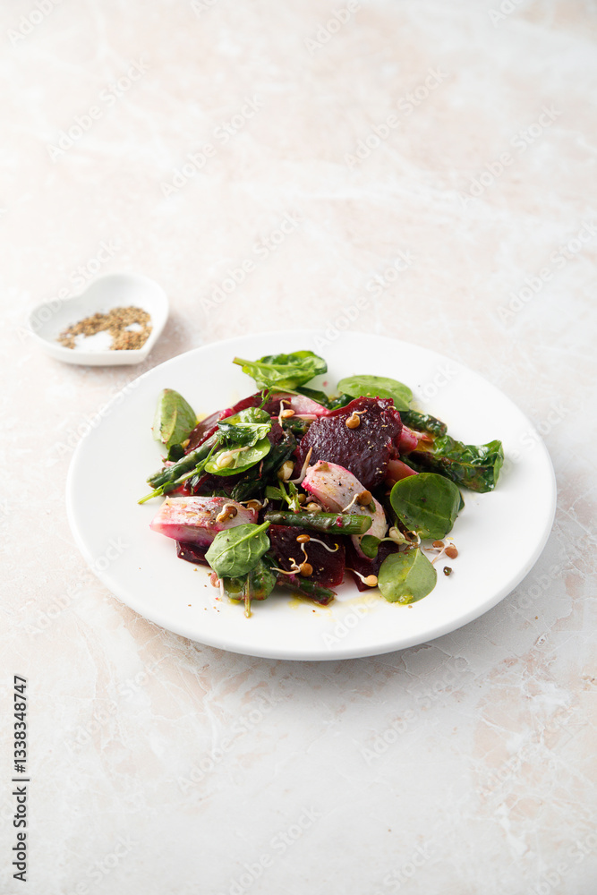 Herring salad with beetroot and spinach