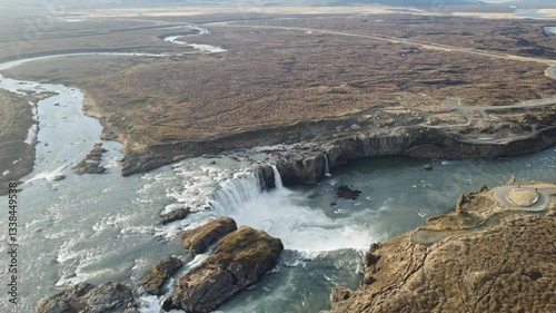 aerial footage of golden hour godafoss waterfall in iceland