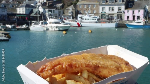 Fish (Cod) and chips on harbourside of the fishing port and 'foodie' destination of Padstow in Cornwall