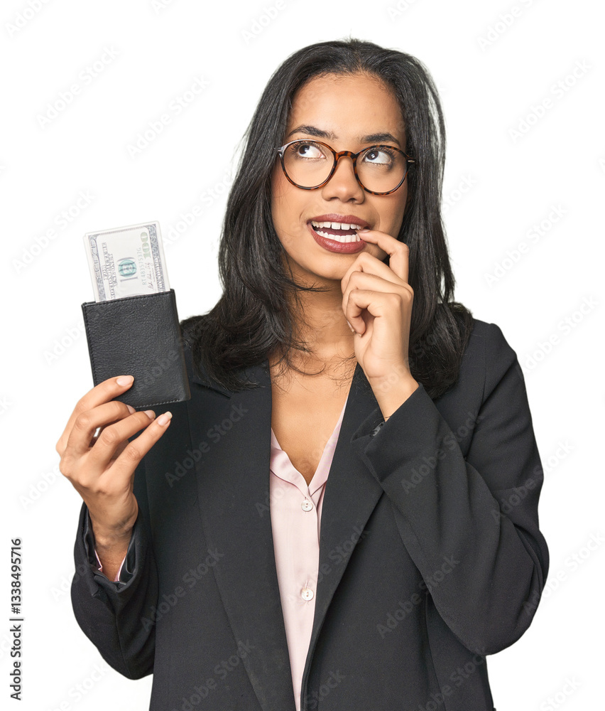 Young Latina in business suit with passport relaxed thinking about something looking at a copy space. Young Latina in business suit with passport relaxed thinking about something looking at a copy space.