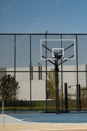 Obraz na płótnie Outdoor public basketball hoop at sport stadium . Vertical format. w salonie
