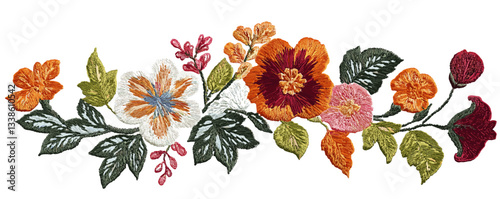 Colorful floral embroidery with vibrant flowers and leaves on white background.