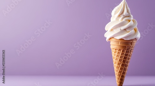 A beautiful soft serve ice cream cone stands against a pastel purple backdrop, showcasing the delectable twist of creamy dessert. Perfect for summer imagery and food content. photo