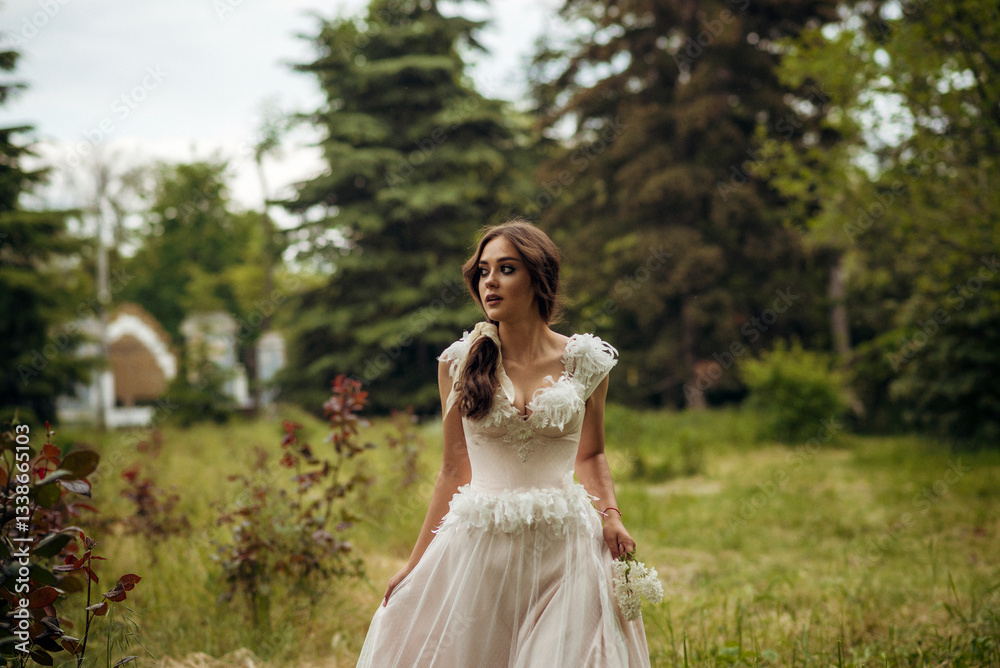 Stunning bride gracefully poses in a spring park, among blossoming trees. exuding elegance, Stunning bride gracefully poses in a spring park, among blossoming trees. exuding elegance,