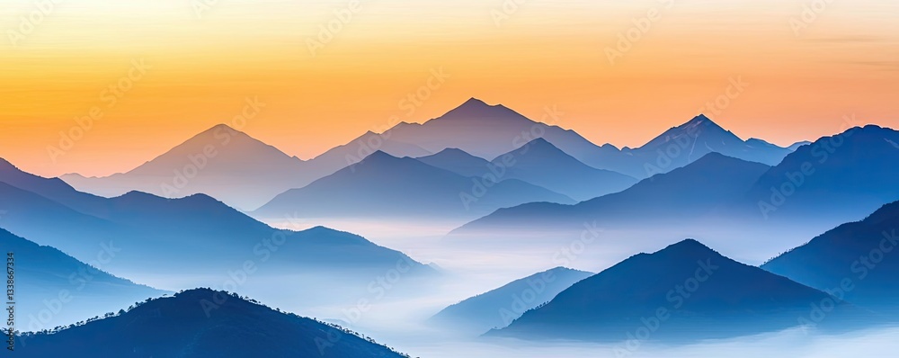 Obraz premium Misty mountains scenic view landscapes concept. Serene mountain range at sunset with mist and soft blue hues.