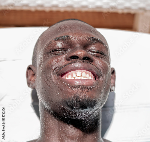 African Descent Man Smiling with Eyes Closed