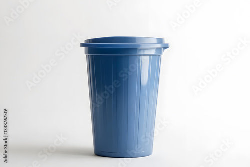 Wallpaper Mural Modern sleek small blue plastic trash bin for office minimalist design on white background with light and shadow. Garbage container with lid. Concept of cleaning waste separation and public hygiene. Torontodigital.ca