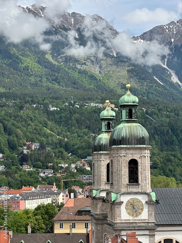 Obraz na płótnie View of Innsbrucker Dom cathedral towers with the Alps mountains in the background, Innsbruck, Tyrol, Austria, May 2024 w salonie