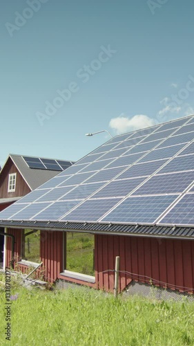 Wallpaper Mural Barn roof covered in solar panels, green energy production, copy space. Vertical Torontodigital.ca
