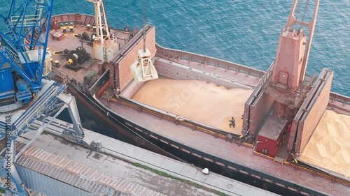 Maritime Grain Trade, Loading Corn onto a Cargo Ship. View from drone