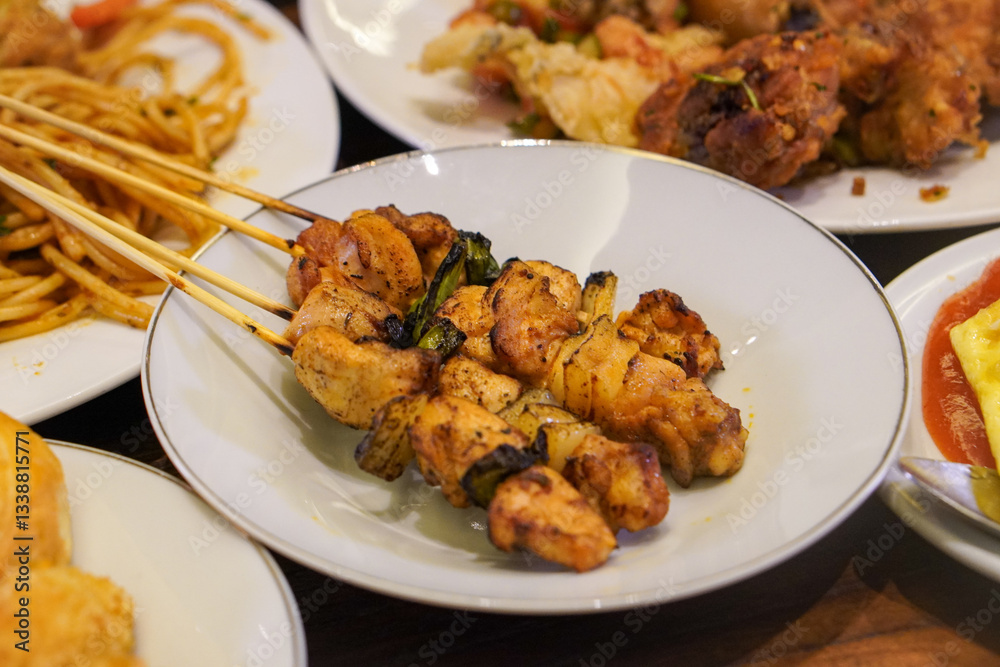 Indonesian satay, captured on March 17, 2025. Grilled skewered meat coated in rich spices and served with savory peanut sauce, creating a flavorful and authentic dish Indonesian satay, captured on March 17, 2025. Grilled skewered meat coated in rich spices and served with savory peanut sauce, creating a flavorful and authentic dish