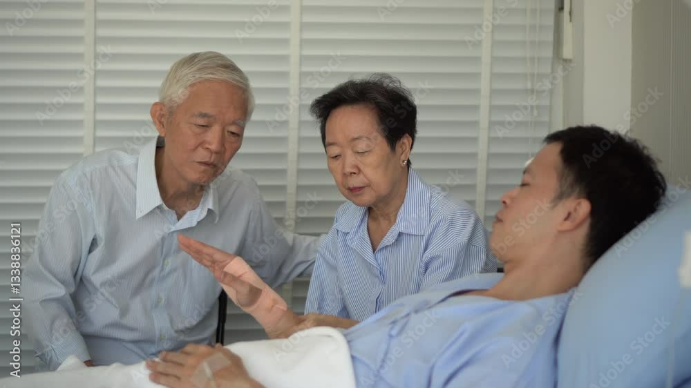 Asian senior parents pay visit adult son worry child injure in hospital bed 4k Asian senior parents pay visit adult son worry child injure in hospital bed 4k