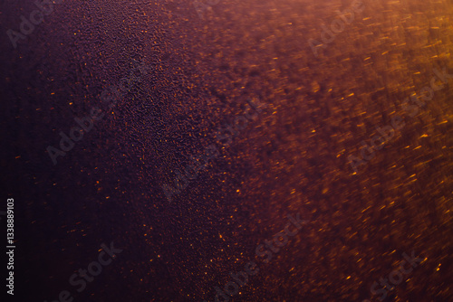 Blurred bokeh light sparkle on golden black background