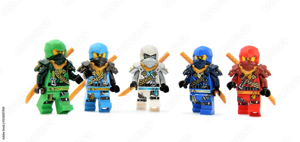 Obraz premium Editorial illustrative image of lego ninjago minifigures team of green ninja Lloyd, water ninja Nia, fire ninja Kai, Jay and Zane isolated on white.