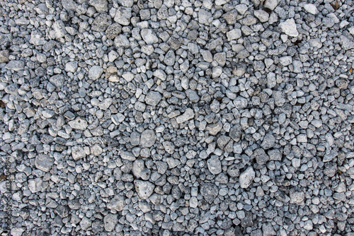 A textured surface of small gray gravel stones, perfect for industrial, natural, or design use. Ideal for landscaping, construction, and earthy themes.