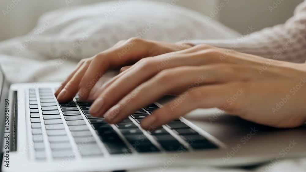Focused female hands typing on laptop in cozy home environment showing concentration and productivity Focused female hands typing on laptop in cozy home environment showing concentration and productivity