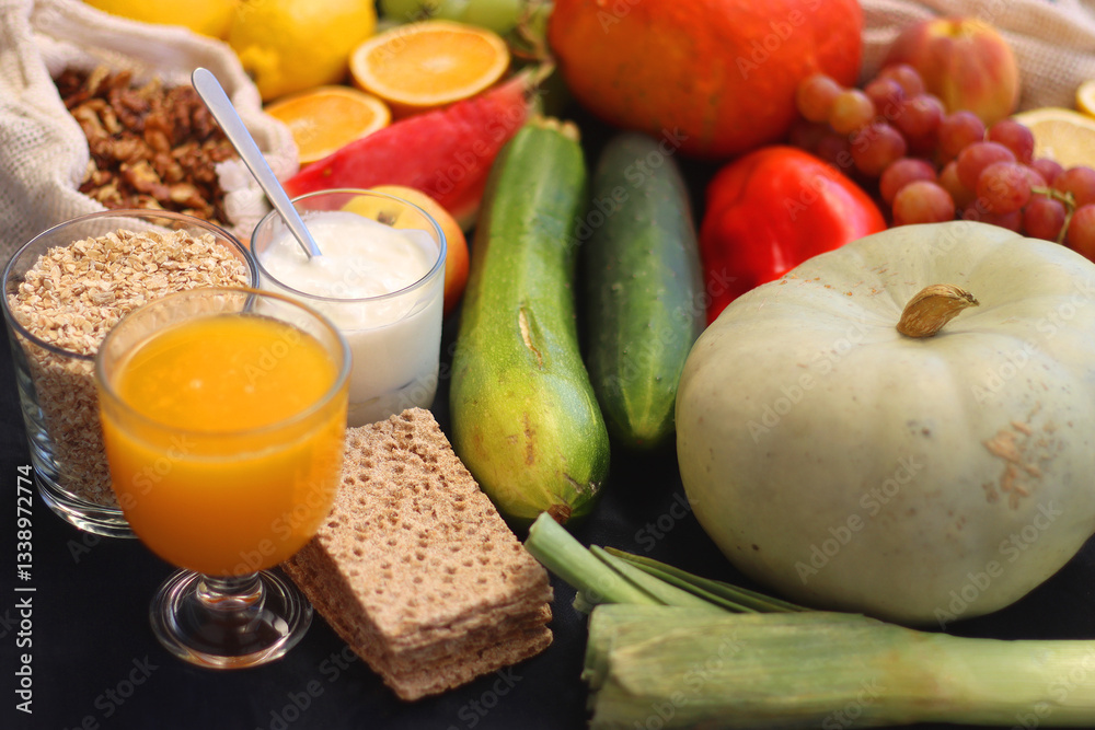 Various healthy fruits, vegetables and cereals on dark background. Selective focus.