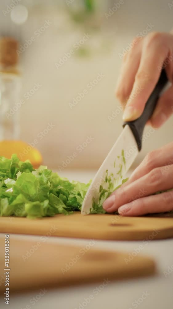 An expectant mother skillfully cuts lettuce in her warm kitchen, focusing on preparing fresh ingredients. This moment captures her dedication to healthy cooking during pregnancy An expectant mother skillfully cuts lettuce in her warm kitchen, focusing on preparing fresh ingredients. This moment captures her dedication to healthy cooking during pregnancy