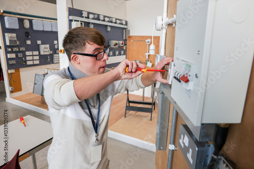Man with Down Syndrome working in workshop