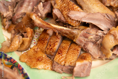 Wallpaper Mural Deliciously sliced roast duck resting on a vintage plate, showcasing crispy, golden brown skin and tender meat, perfect for any meal Torontodigital.ca