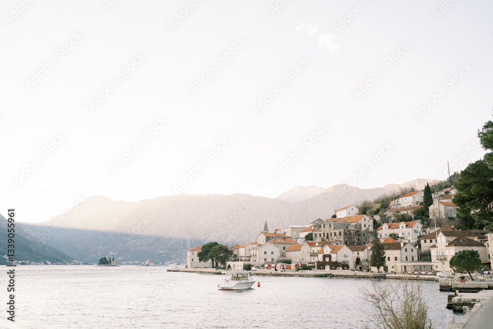 Fototapeta premium Excursion boat is moored in the sea off the coast of Perast. Montenegro