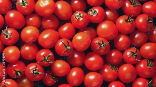 Red tomatoes background texture. Green stems fresh vegetables. Food ads cooking blog recipe. Macro close-up dark background video