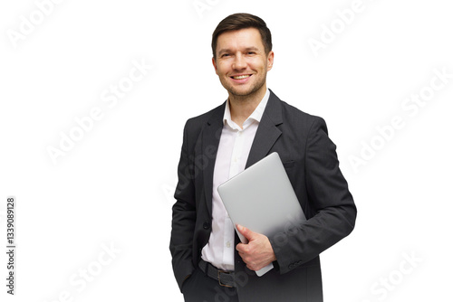Professional man in business attire holding a laptop and smiling against a white background