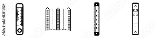 Rulers and measuring tools arranged in a neat row for precise measurements and drafting purposes
