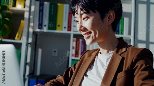 The Professional Smiling at Laptop