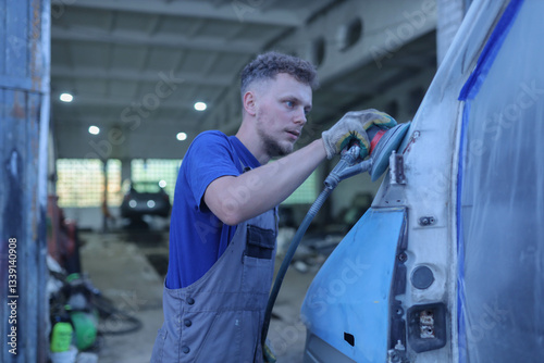 man polishing car paint before painting, truck repair
