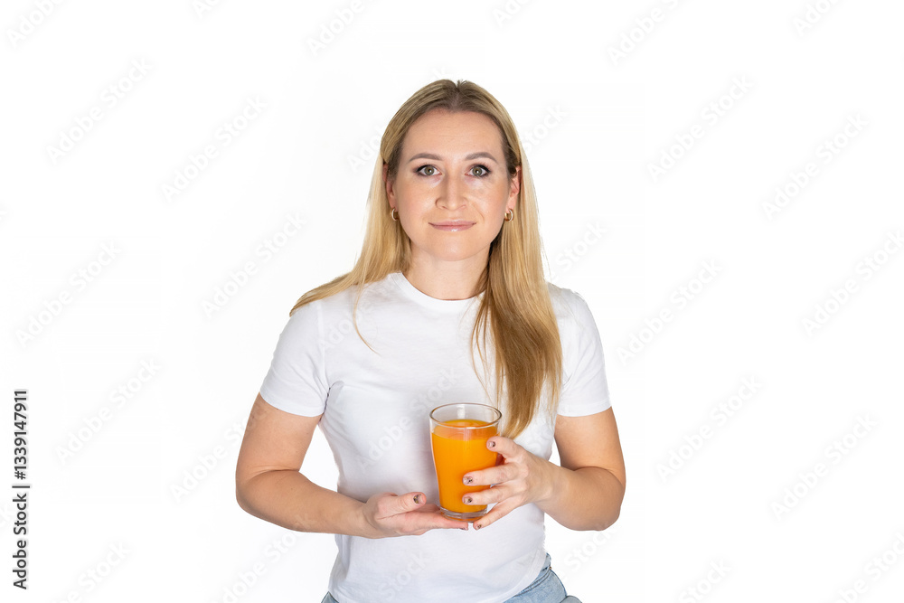 Young blonde woman with orange juice glass isolated white background holding juice. Portrait of woman in white t-shirt with cup of drink. Mockup. Young blonde woman with orange juice glass isolated white background holding juice. Portrait of woman in white t-shirt with cup of drink. Mockup.