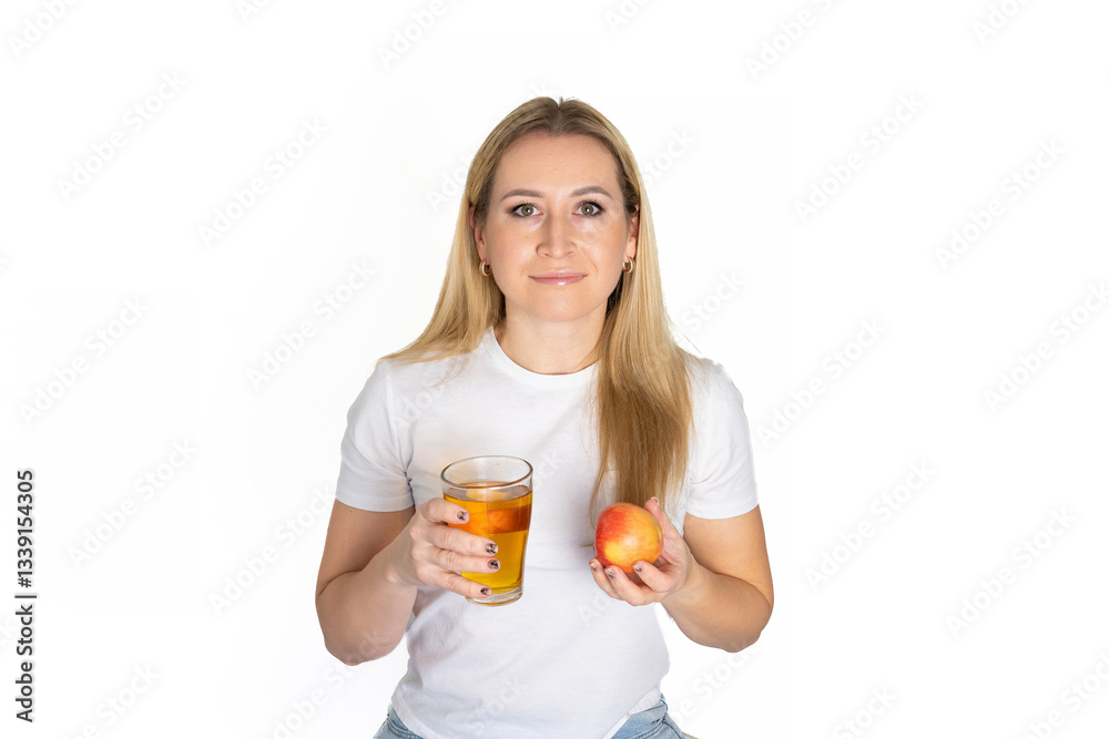 Beautiful fun happy blonde woman holding in hands red apple fresh apple juice glass isolated white background. Proper nutrition, dieting concept. Copy space advertisement. Advertising area Beautiful fun happy blonde woman holding in hands red apple fresh apple juice glass isolated white background. Proper nutrition, dieting concept. Copy space advertisement. Advertising area