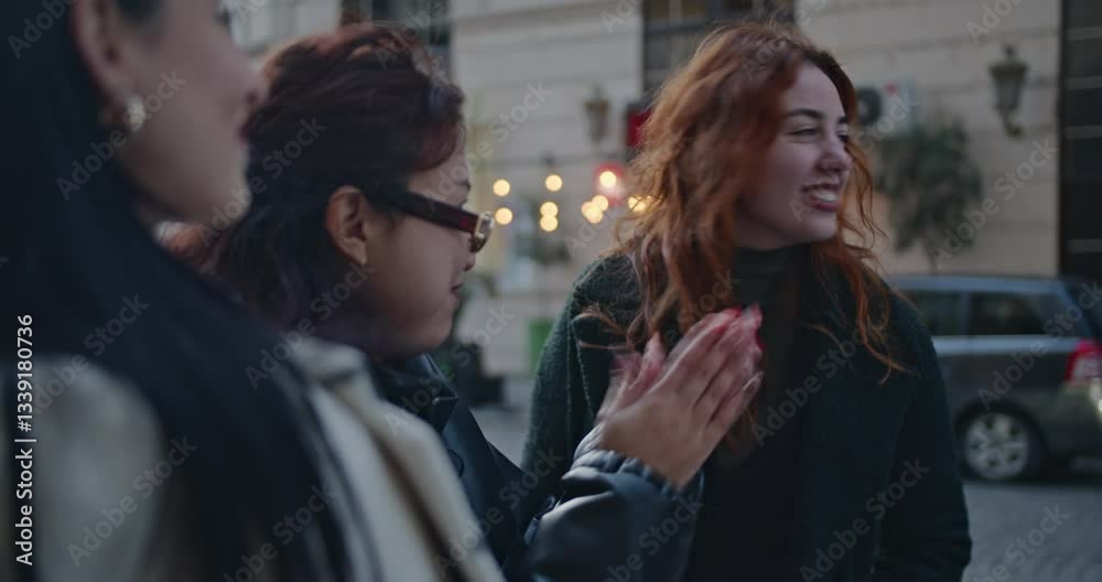 Three diverse businesswomen collaborate on a project during an outdoor meeting in the city, discussing ideas. Three diverse businesswomen collaborate on a project during an outdoor meeting in the city, discussing ideas.