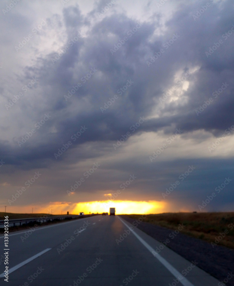 Fototapeta premium Mystical dark sky with bright light in the center on the road