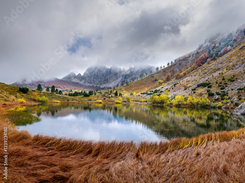 Autumn landscape with mountains and lake