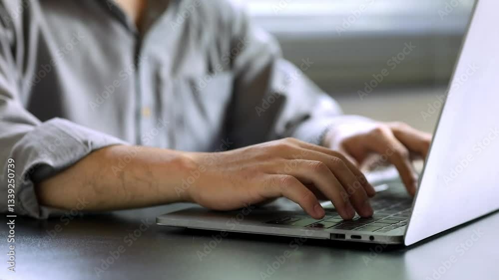 A close-up view of hands typing on a laptop in a sleek office setting, highlighting modern workspace aesthetics and the essence of productivity and technology. A close-up view of hands typing on a laptop in a sleek office setting, highlighting modern workspace aesthetics and the essence of productivity and technology.