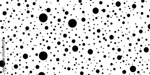 dense polka dot seamless pattern with various black circles on white background