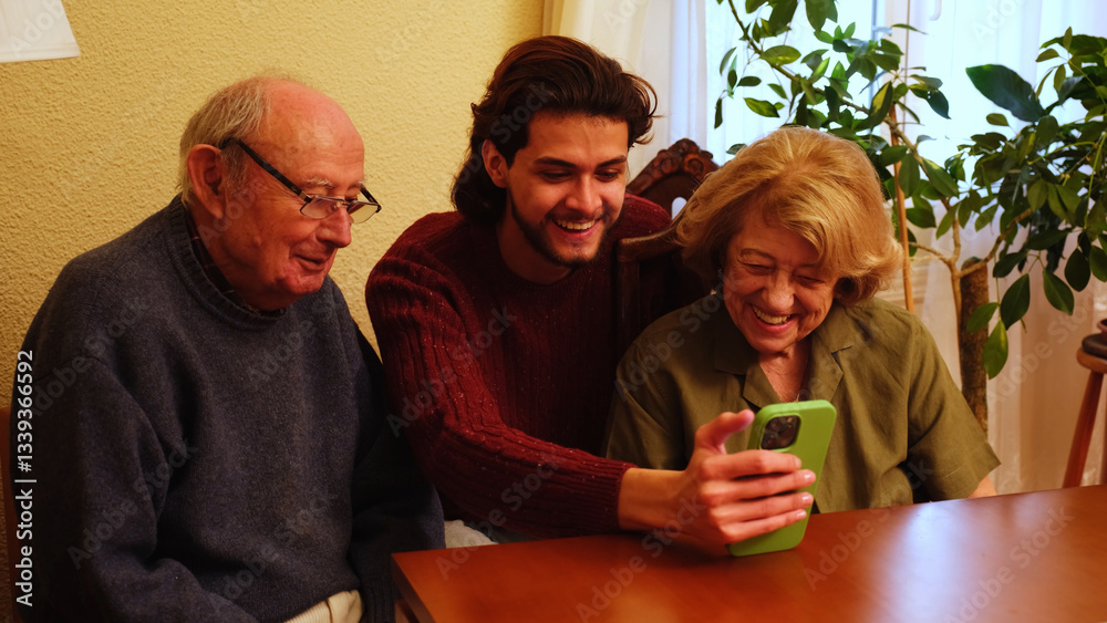 Grandparents and grandson laughing and using smartphone at home