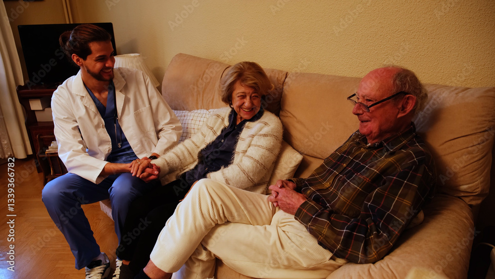 Young male doctor holding hand of senior woman and comforting worried senior couple at home
