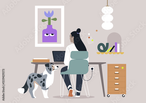 Designer focuses on a laptop in a cozy setup adorned with stylish decor, while an inquisitive dog stands nearby, creating a warm atmosphere perfect for creativity