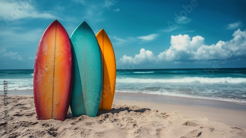 Three Surfboards Stand on Beach Near Palm Trees During Daytime