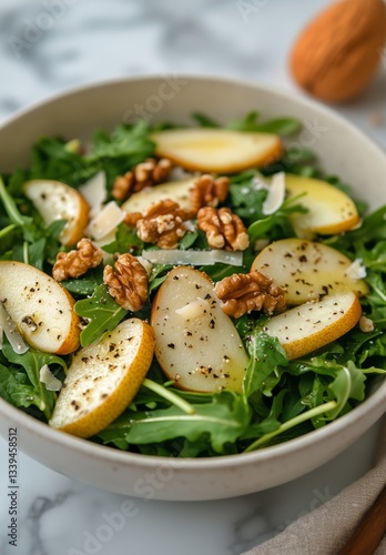 Pear and Arugula Salad With Walnuts Served in a Bowl at Lunchtime