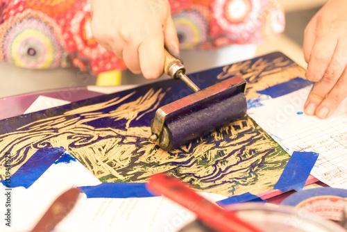 Applying Ink with Brayer on Decorative Linocut Block